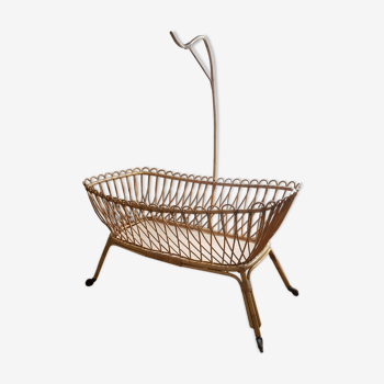 Vintage rattan cradle with swan collar