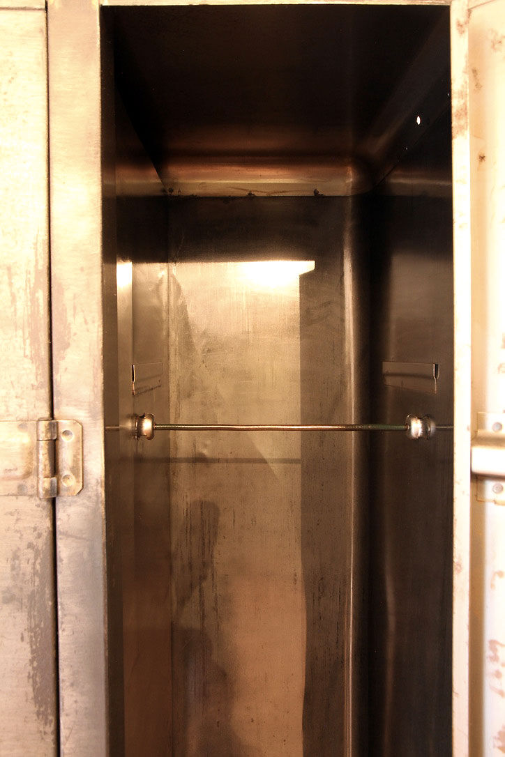 Industrial metal cloakroom with rounded corners.