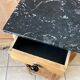 Furniture in raw wood and black marble