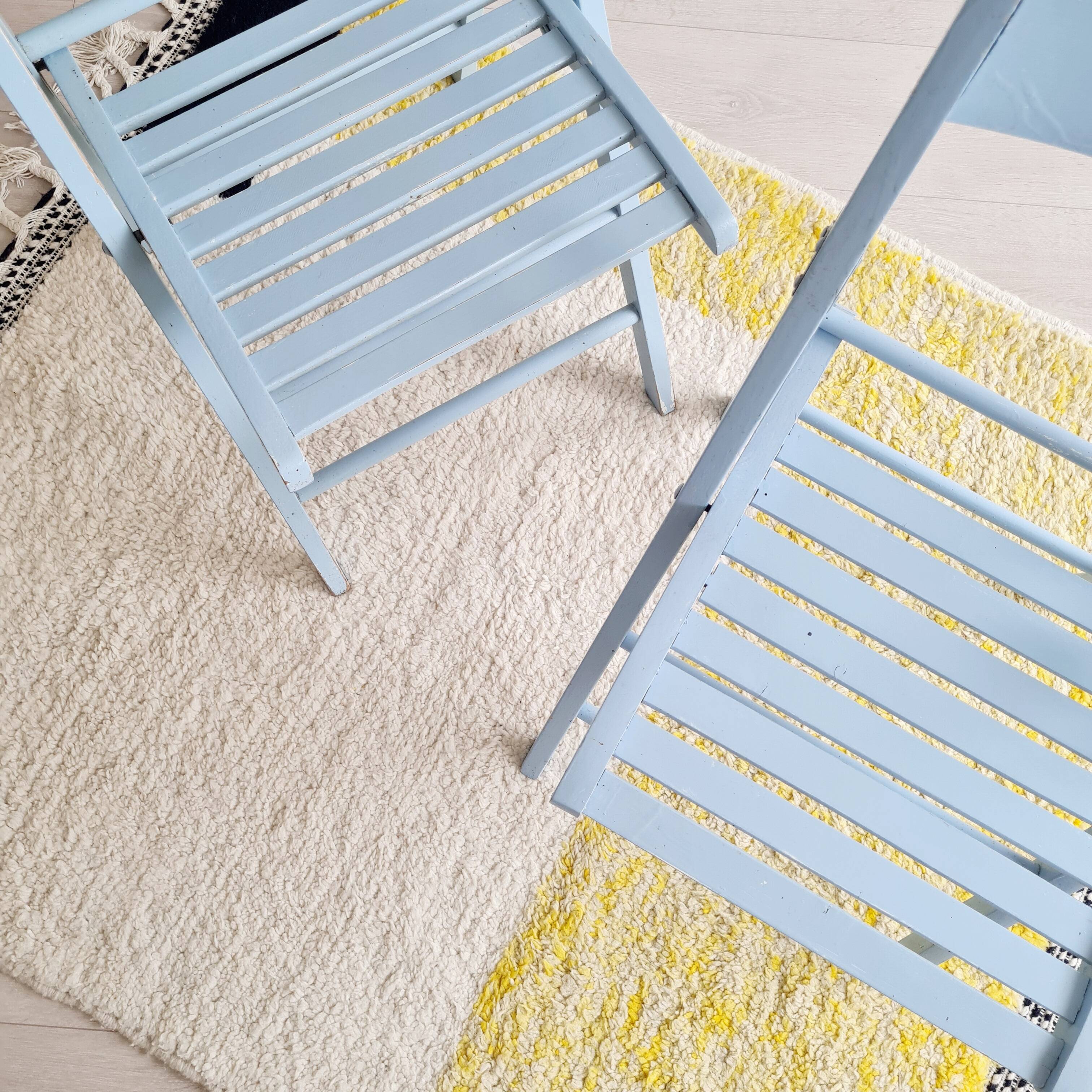 Blue folding chairs in lacquered wood