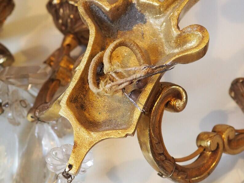 French antique Louis XV style twin arm wall sconces in bronze with crystals.