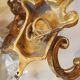 French antique Louis XV style twin arm wall sconces in bronze with crystals.