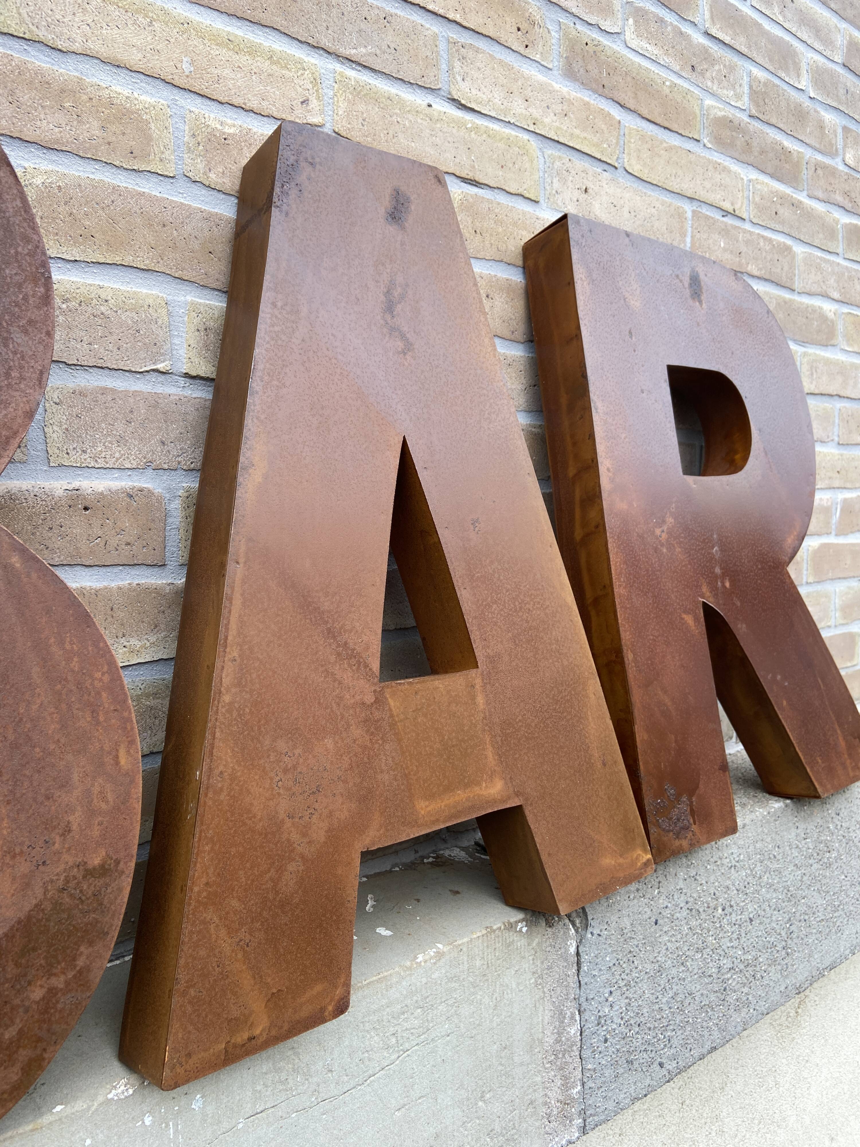 Bar sign in vintage metal letters
