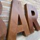 Bar sign in vintage metal letters