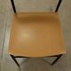 Vintage chairs from the 1960s in enamelled metal, faux leather and foam.