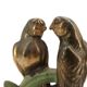 Art Deco pair of bookends with metal parrots and a marble base.