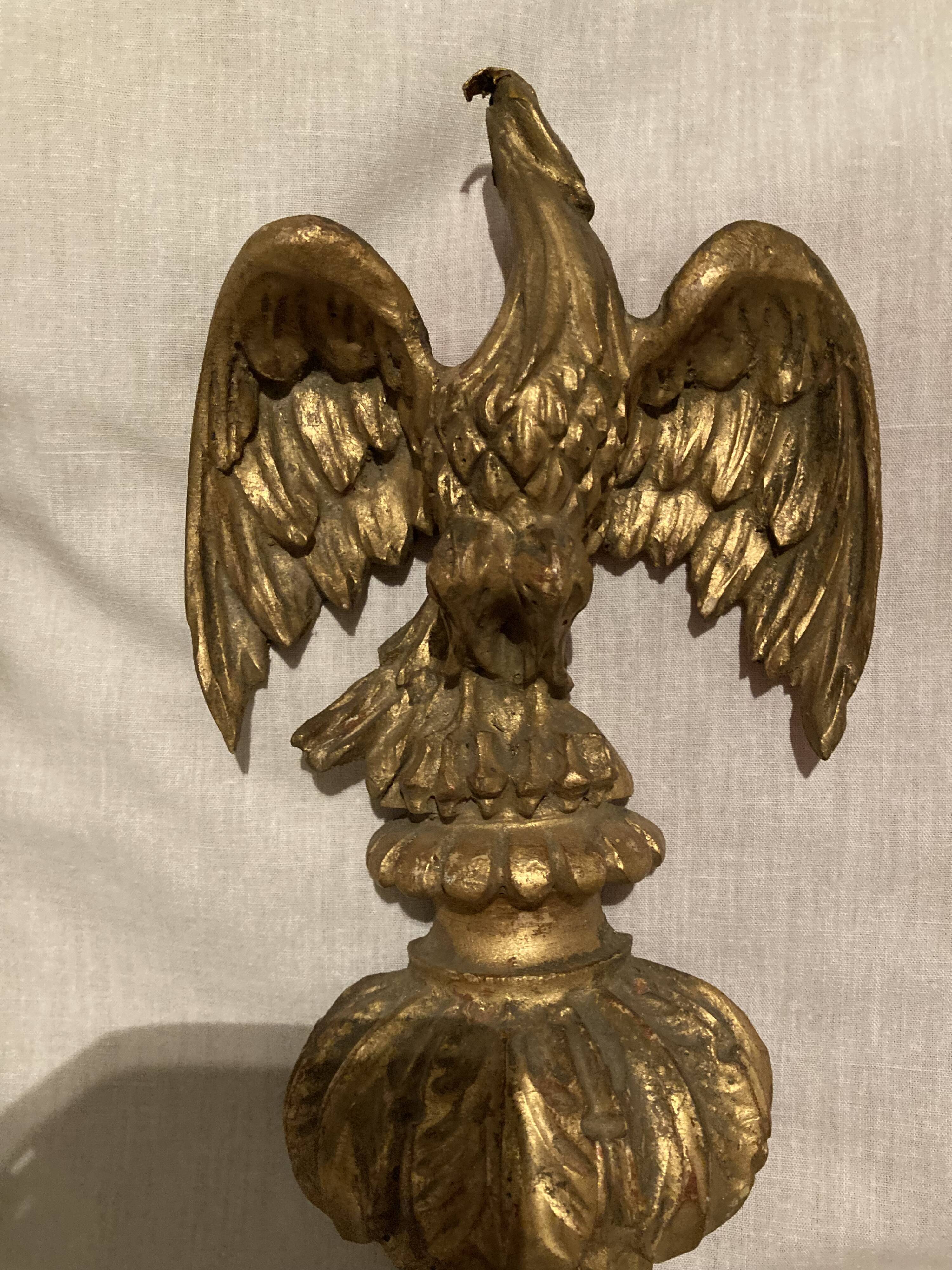 Pair of candle holders in wall, eagle pattern in gilded wood and brass