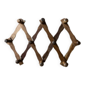 Extendable wooden wall-mounted coat rack