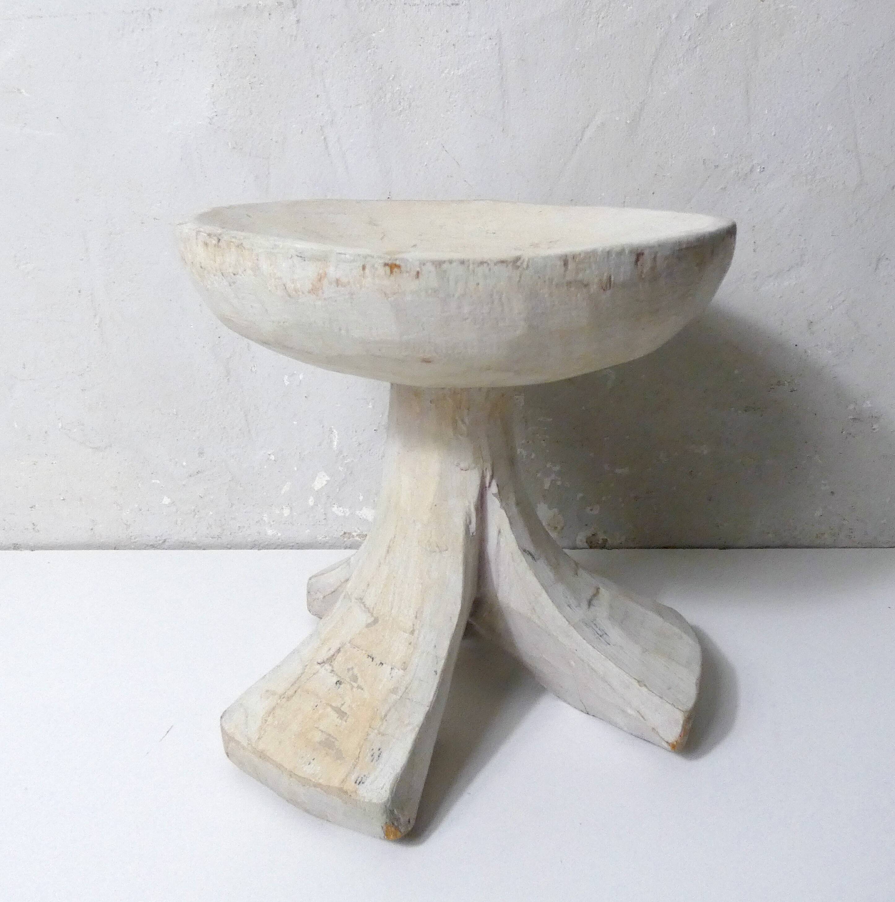 antique small tripod bench/stool in solid carved brutalist wood