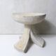 antique small tripod bench/stool in solid carved brutalist wood