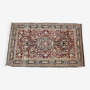 Antique hand-knotted silk Persian rug