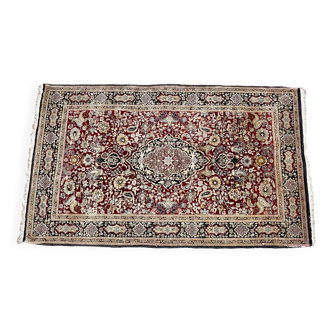 Antique hand-knotted silk Persian rug