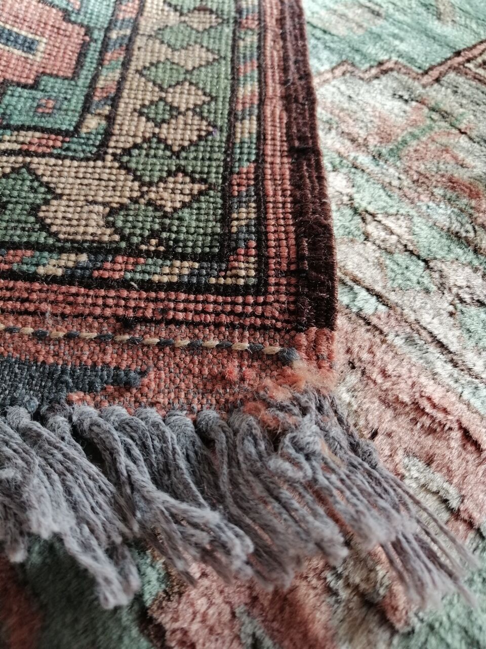Afghan rug in pastel colors