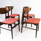 Set of four dining room chairs in rosewood and upholstered with red fabric, of danish design, 1960s