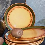 Six vintage stoneware plates with green net