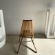 Foldable designer armchair in wooden slats