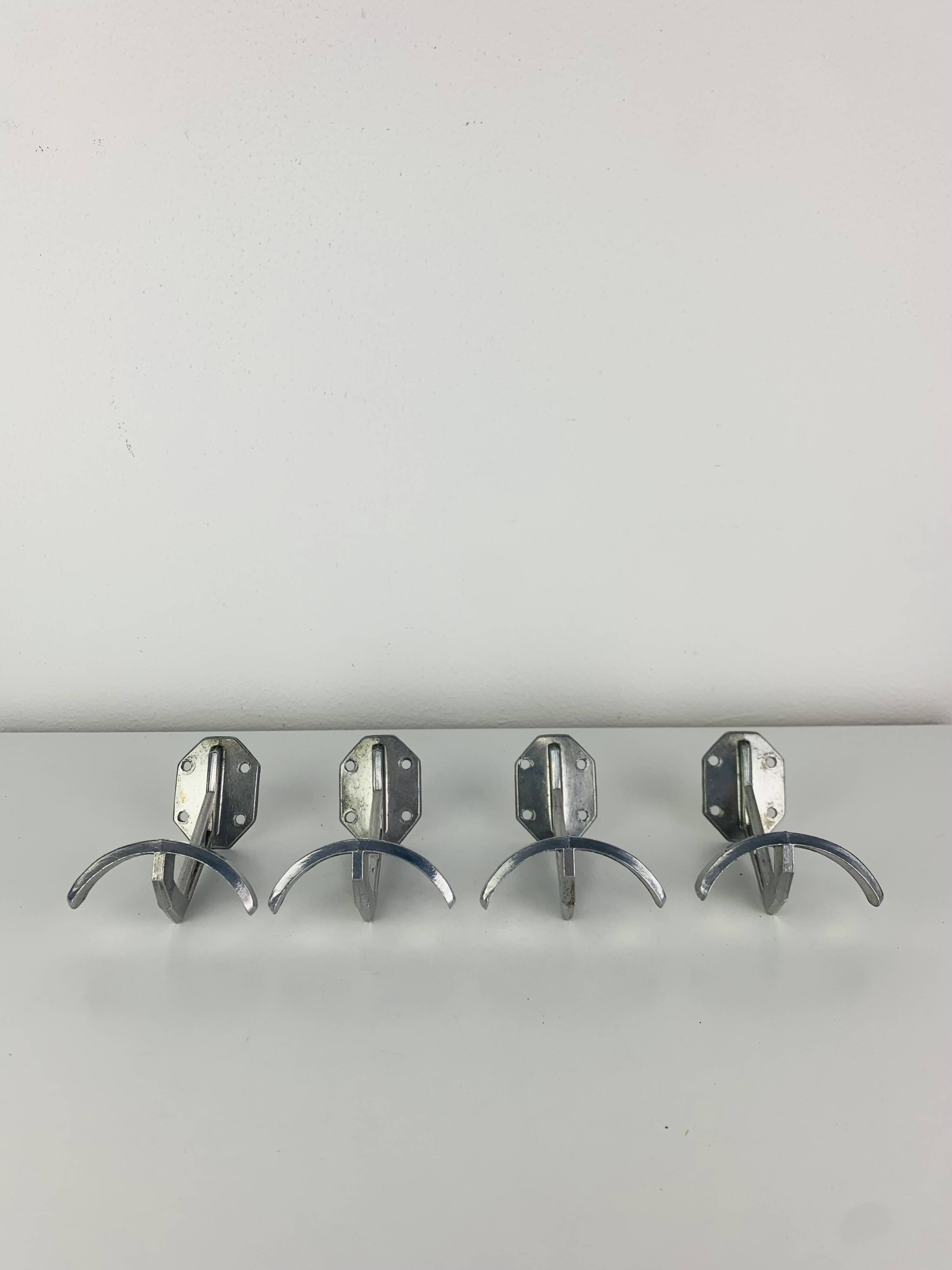 4 wall hooks in aluminium, 1950s
