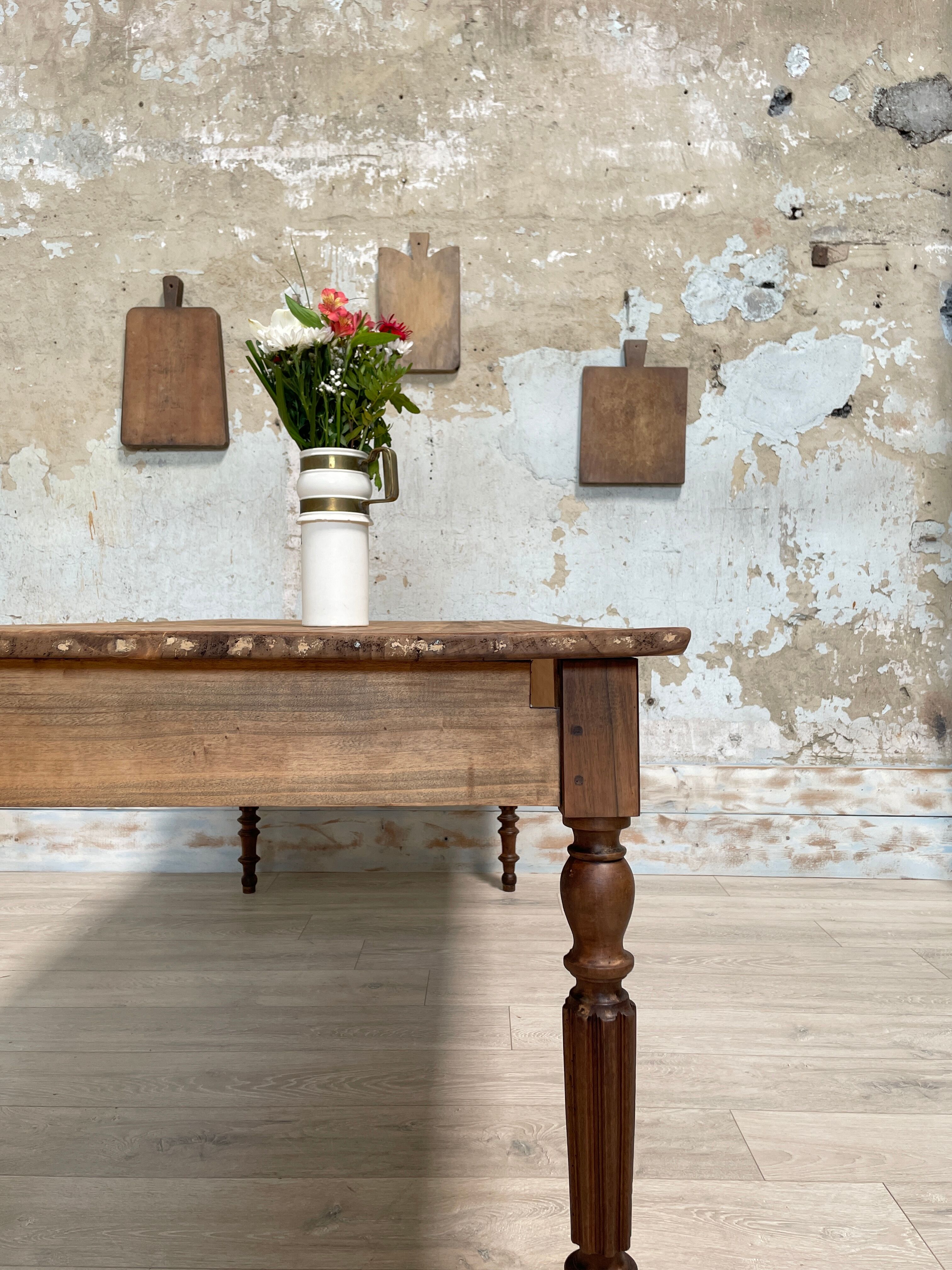 Vintage farmhouse table with turned legs.