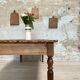 Vintage farmhouse table with turned legs.