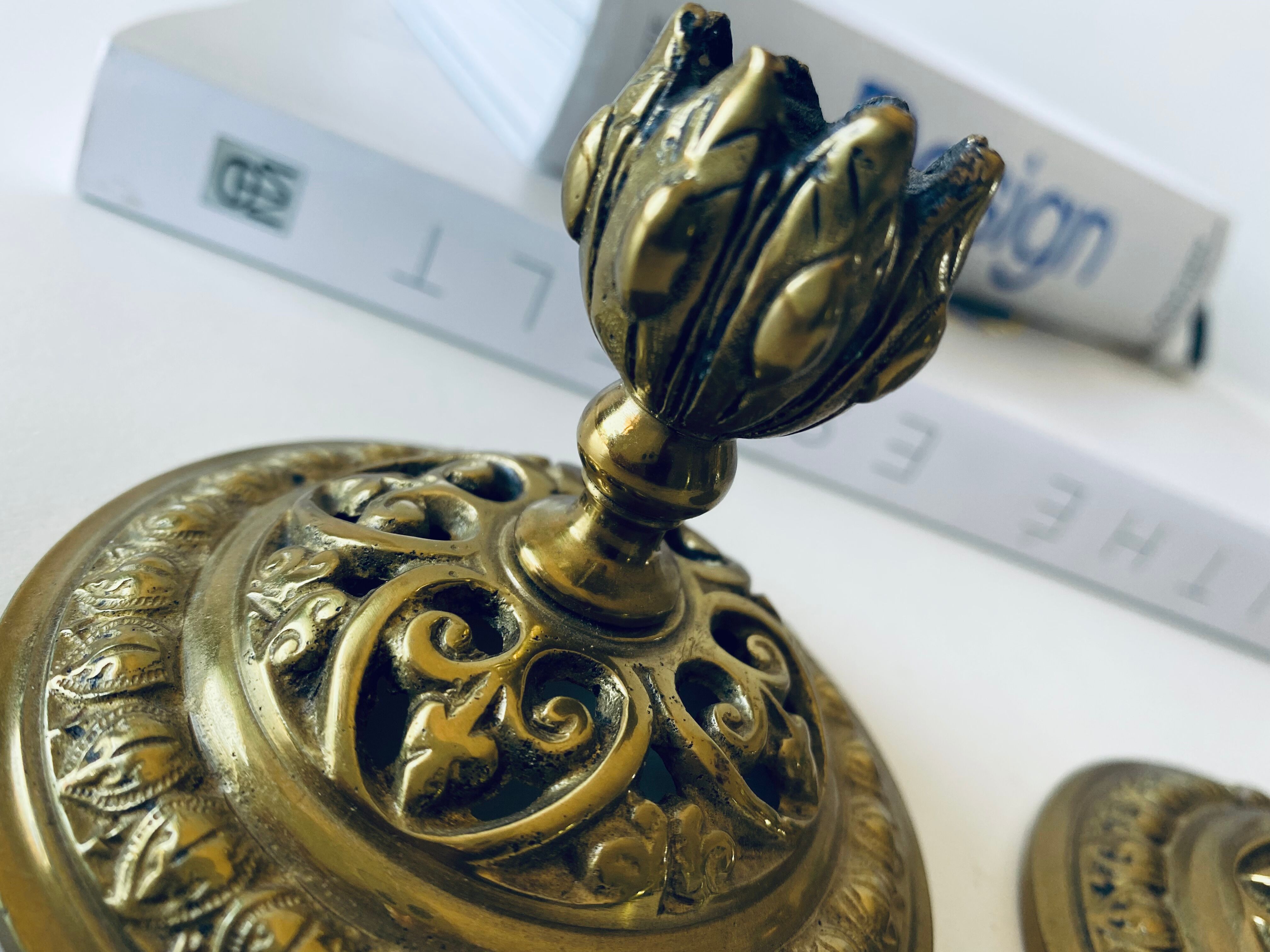 Pair of bronze candle holders signed