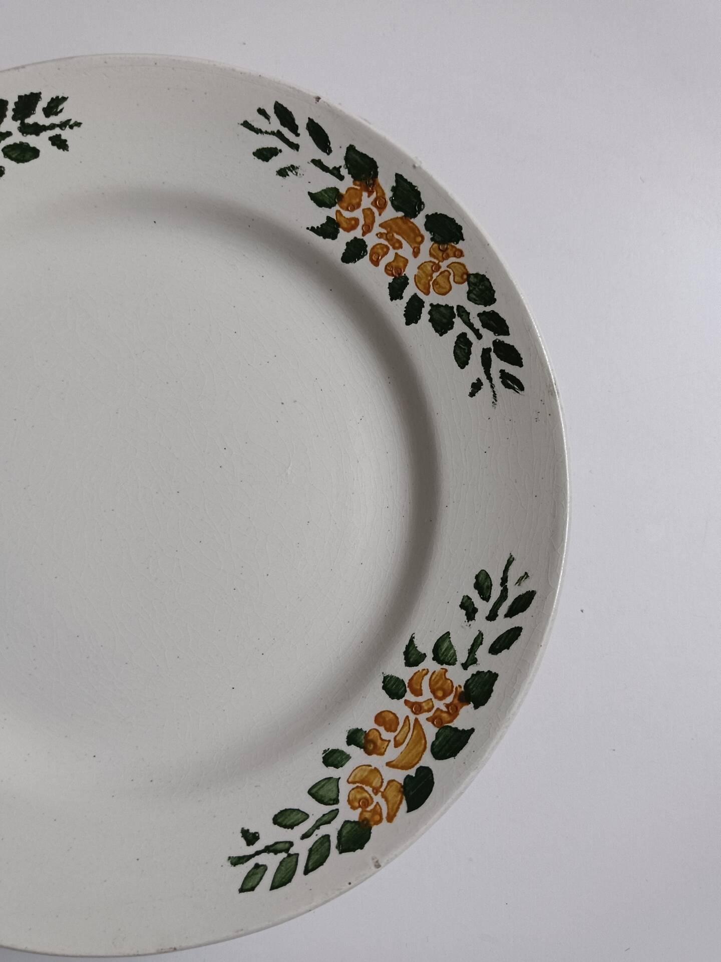 Old round footed plate signed Labrut brothers flowers