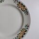 Old round footed plate signed Labrut brothers flowers
