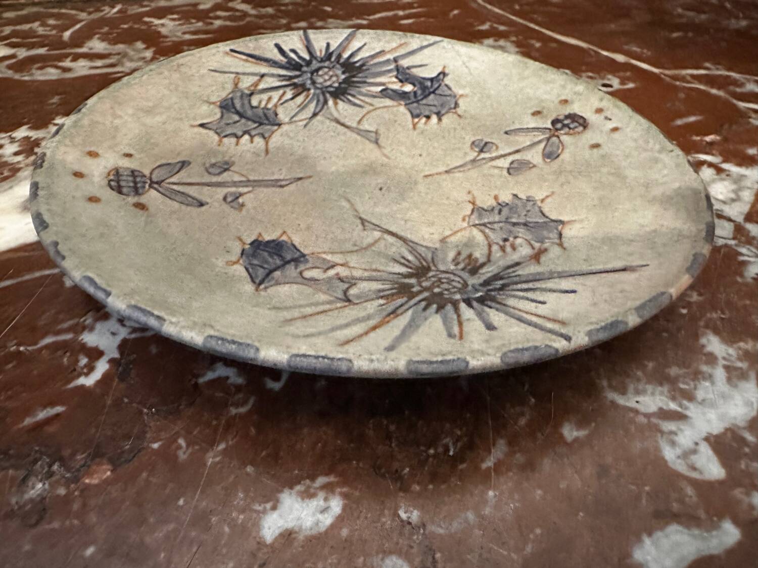 Ceramic plate signed by Marie-Madeleine Jolly – thistle decoration – year