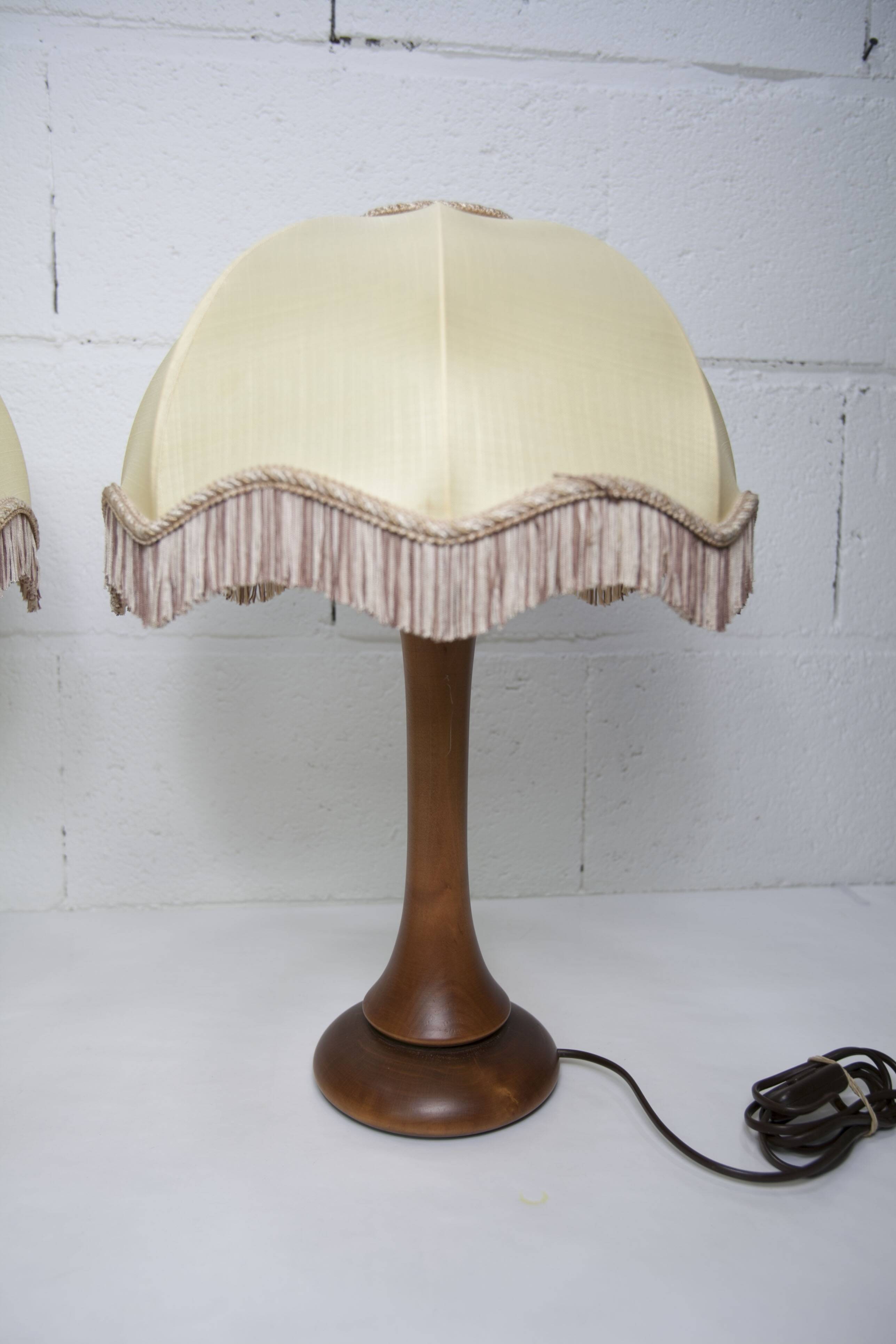 Pair of 1930s Art Deco bedside lamps with fringes, solid wood legs 52cm