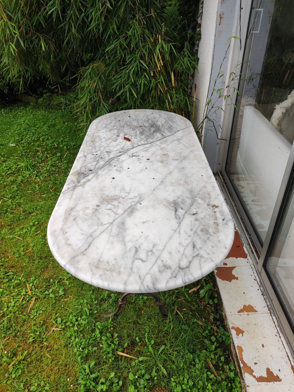 Large marble and wrought iron bistro table
