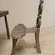 Vintage sculptural wooden table and two chairs, hand-carved loop backrests