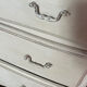 Chest of drawers with 3 curved legs