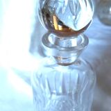 Small round carafe in highly worked cut crystal with stopper