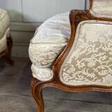 Pair of small Louis XV style wing chairs in carved walnut, Bosson stamp