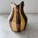Striped decorative pitcher signed