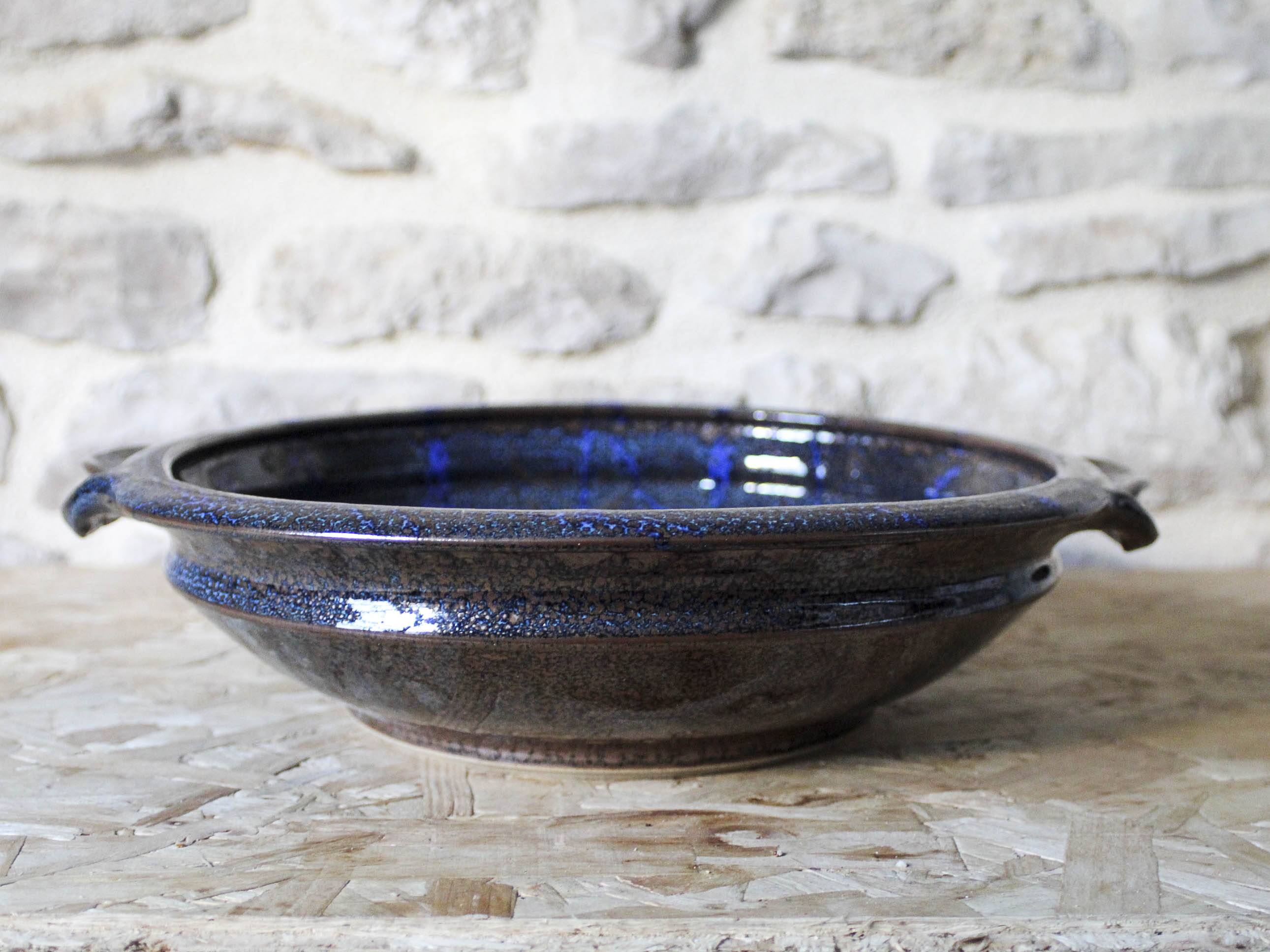 Enamelled ceramic hollow dish signed