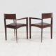 Set of six Italian wooden dining chairs in dark brown faux leather.