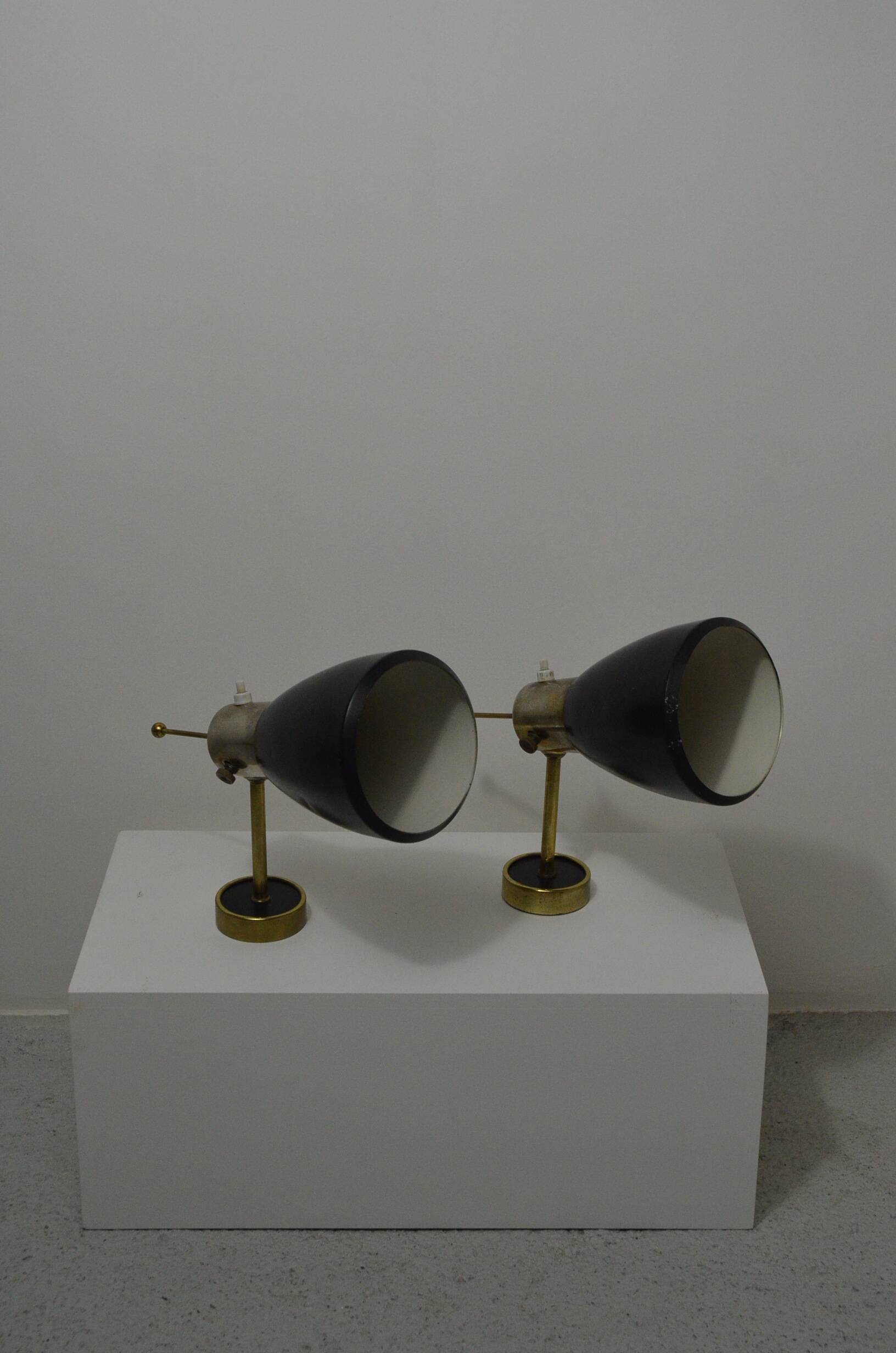 Pair of Monix wall lights in black lacquered metal and brass