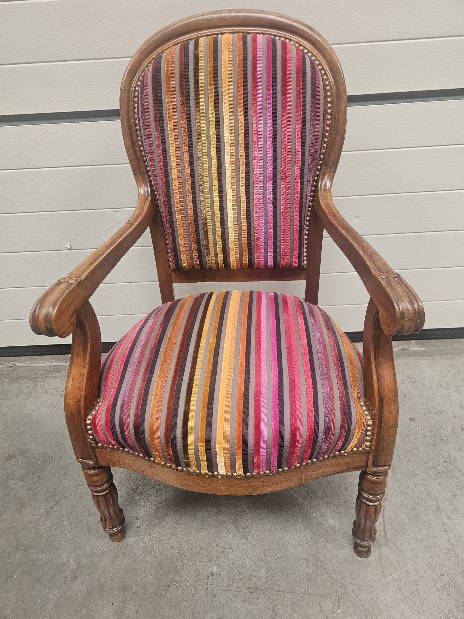 Antique armchair in multi-colored striped velvet with turned legs
