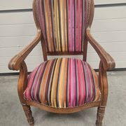 Antique striped multicoloured velvet armchair with turned legs.