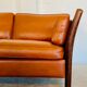 Canapé vintage danois des années 60 en cuir cognac pour 2 personnes.
