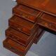 Partner desk with double pedestal in burr yew wood with decorated top.
