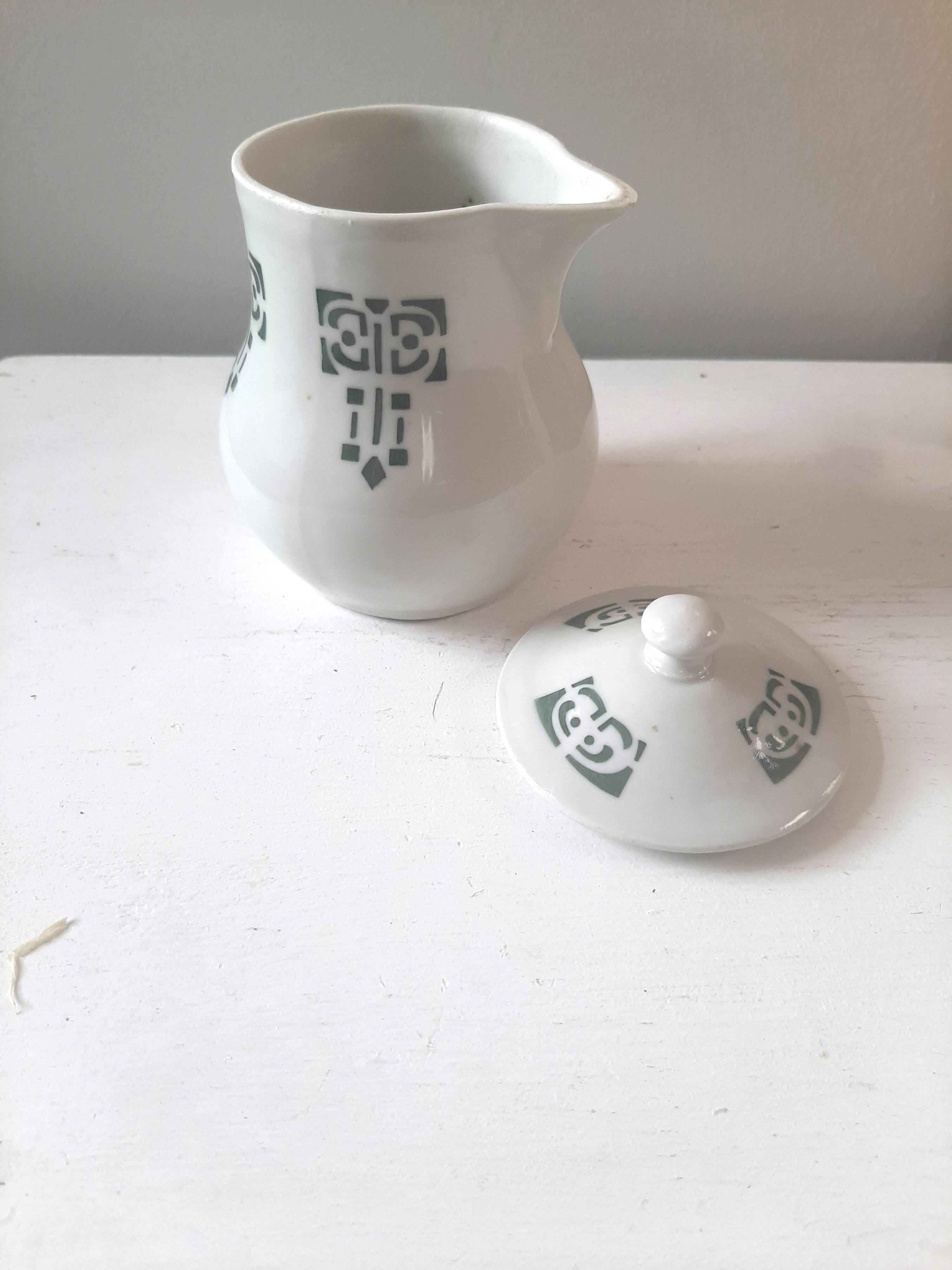 Vintage cream pot with Art Deco pattern and its lid.