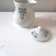 Vintage cream pot with Art Deco pattern and its lid.