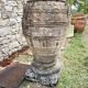 Large Cretan jar in terracotta with three handles on a stone base.