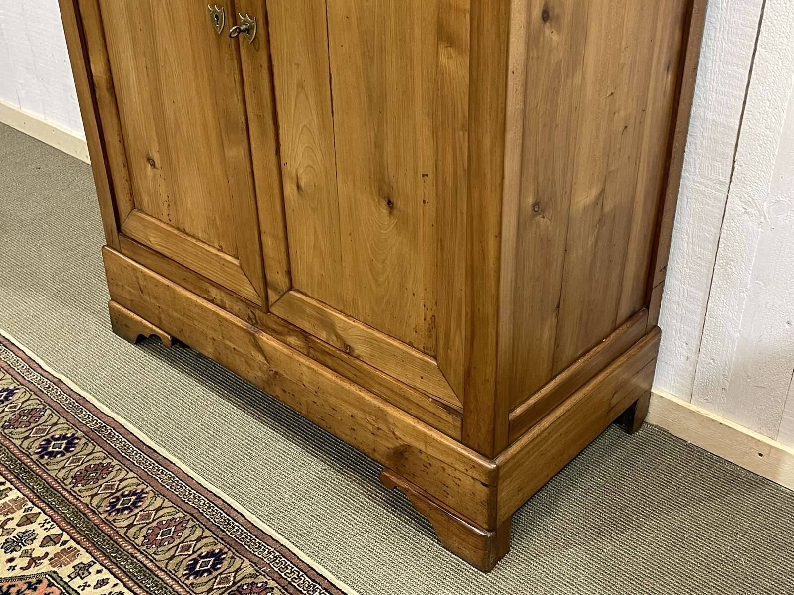 Small Louis Philippe 19th century cherry wood wardrobe with a drawer at the top