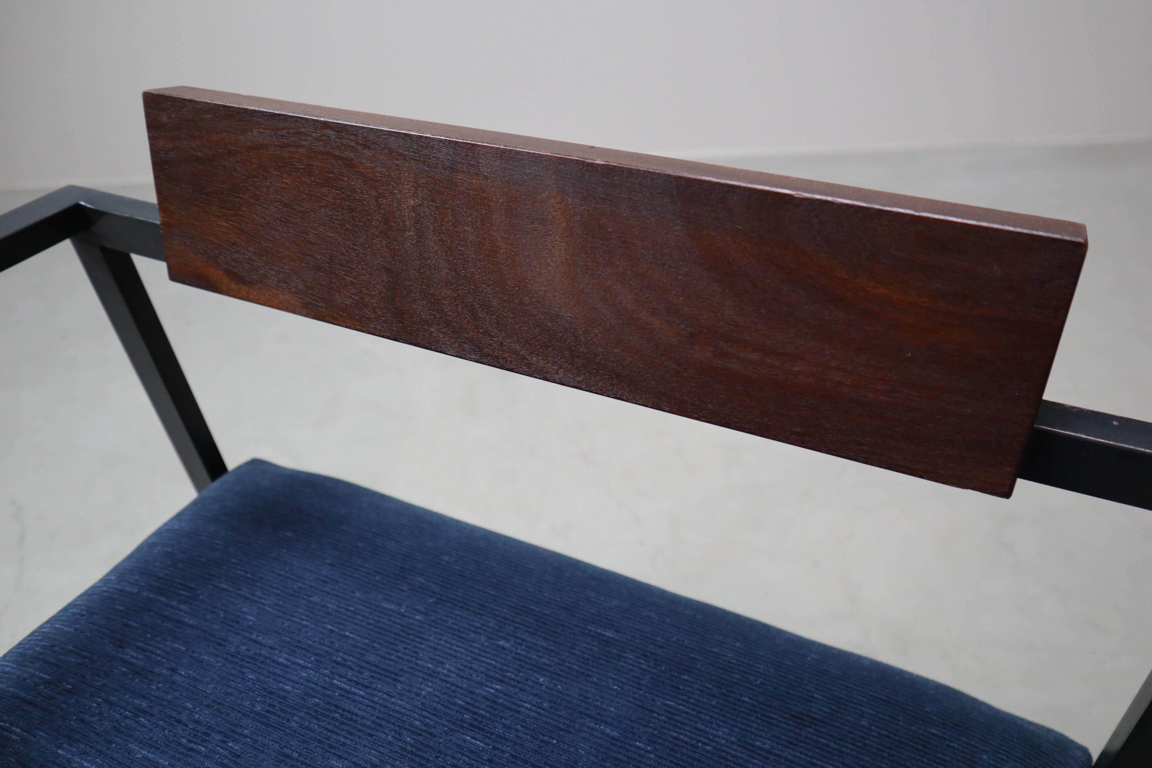 Pair of Postmodern armchairs in steel and mahogany, 1970s