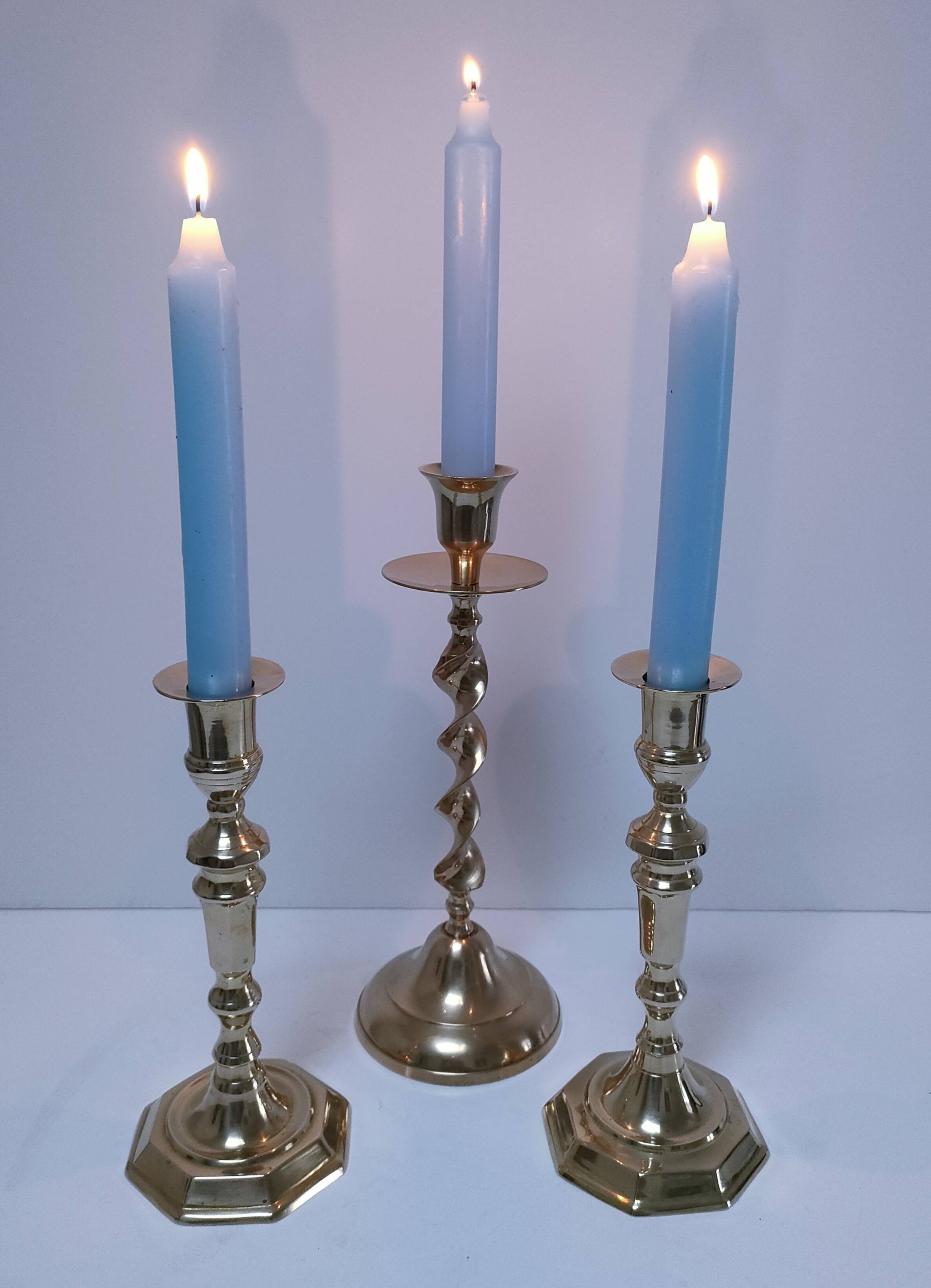 Three vintage solid brass candle holders