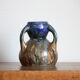 Blue vase in flaming sandstone