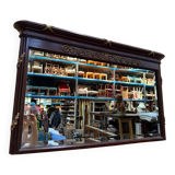 Louis XVI style mirror in mahogany and gold.