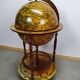 Meuble bar globe en bois sur roulette